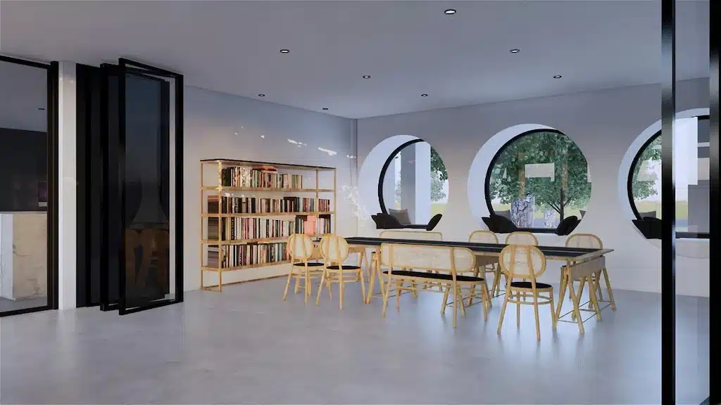 ห้องที่มีโต๊ะ เก้าอี้ และชั้นหนังสือในจันทบุรี ที่พักติดทะเลจันทบุรี