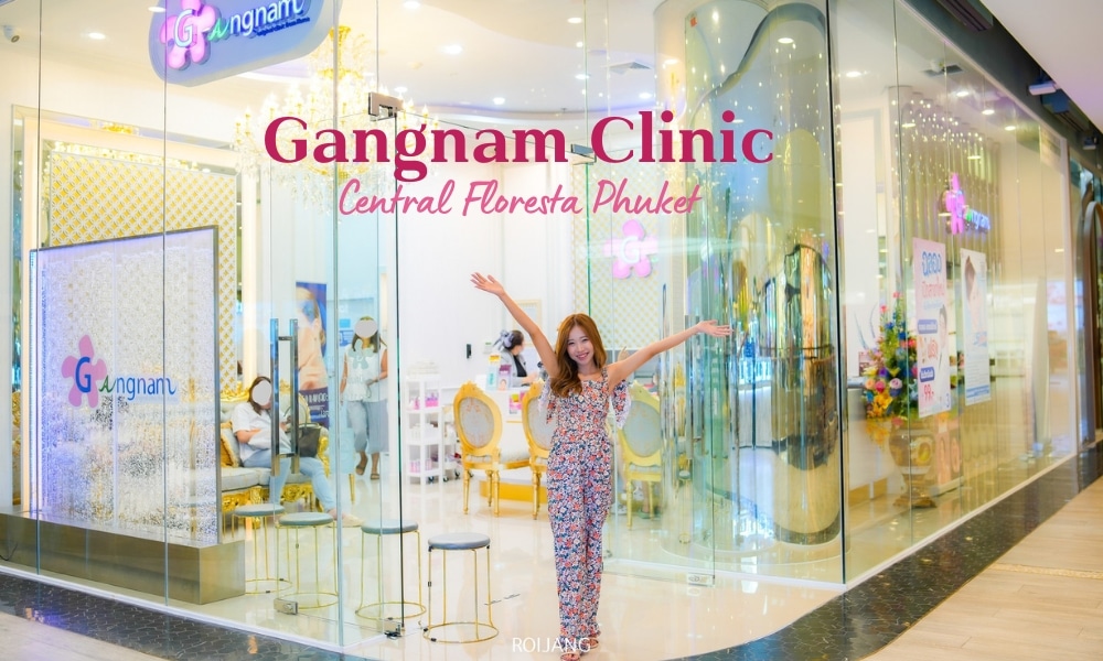ผู้หญิงยืนอยู่หน้าร้านที่มีคำว่า Gangnam Clinic ตั้งอยู่ในจังหวัดภูเก็ต