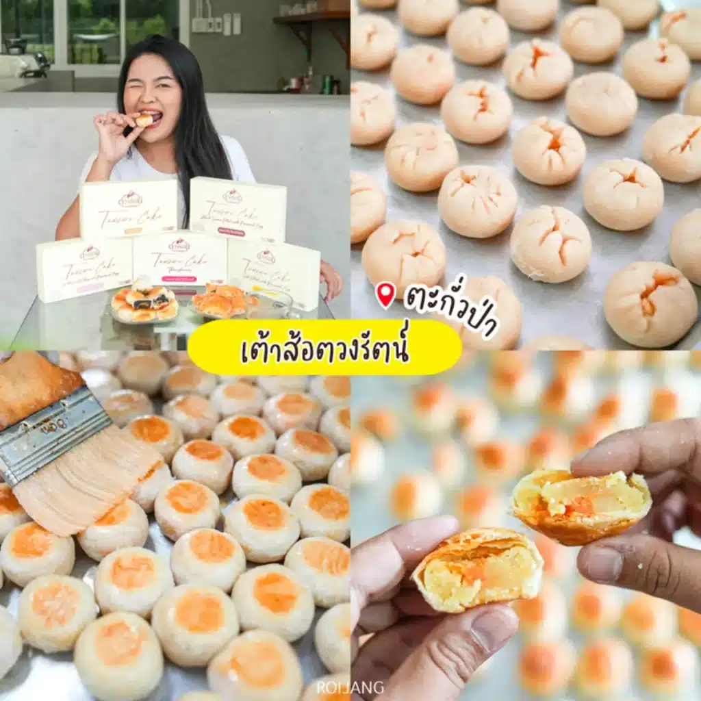 ผู้หญิงคนหนึ่งกินนมเต้าส้อที่โต๊ะพร้อมกล่องขนม ภาพระยะใกล้แสดงเต้าส้อทรงกลมที่มีไส้สีส้มและไข่ล้างแวววาว.