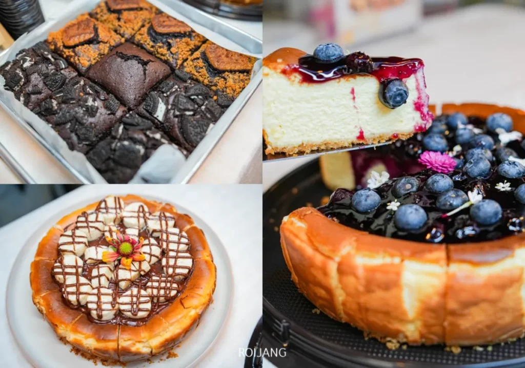 ภาพตัดปะของขนมหวานอบที่ หลาดเพลินเป๋า: บราวนี่สี่เหลี่ยมกับท็อปปิ้ง, ชิ้นชีสเค้กหน้าบลูเบอร์รี่, เค้กราดช็อกโกแลต, และชีสเค้กบลูเบอร์รี่.