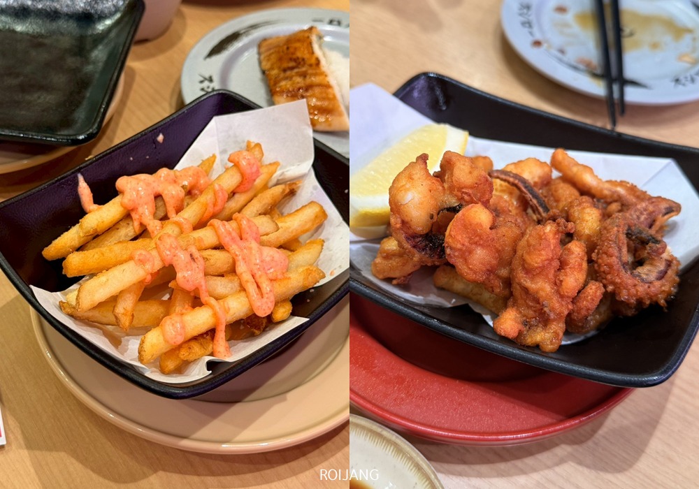 ชามสีดำที่เต็มไปด้วยเฟรนช์ฟรายส์ราดด้วยซอสสีชมพู และชามสีดำที่เต็มไปด้วยอาหารทะเลทอดเสิร์ฟพร้อมมะนาวฝาน ที่ร้านอาหารเซ็นทรัลภูเก็ต.