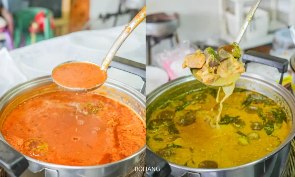 หม้อสแตนเลสสองใบที่ร้านขนมจีนป้าม่อมบรรจุแกงรสเลิศ—หม้อทางซ้ายเต็มไปด้วยแกงแดง ส่วนหม้อทางขวาเป็นแกงสีเขียวอมเหลืองที่อัดแน่นไปด้วยผักและเนื้อสัตว์.